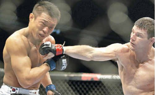 Michael Bisping (right) in action in the Octagon. Michael Bisping (right) in action in the Octagon.